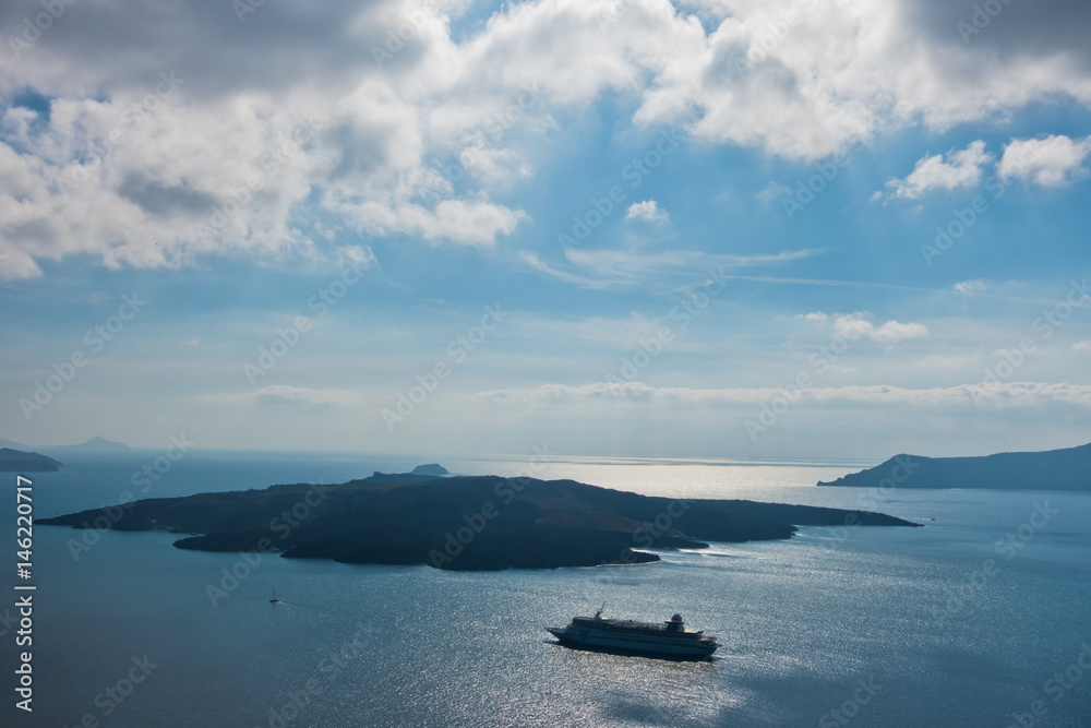 Volcano island with cruisers anchored around at Santorini, Greece