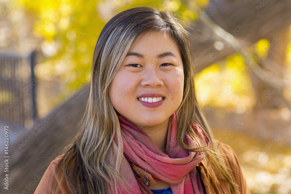 Portrait of smiling Asian woman in autumn Portrait of smiling Asian woman in autumn