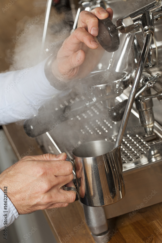 barista steaming milk