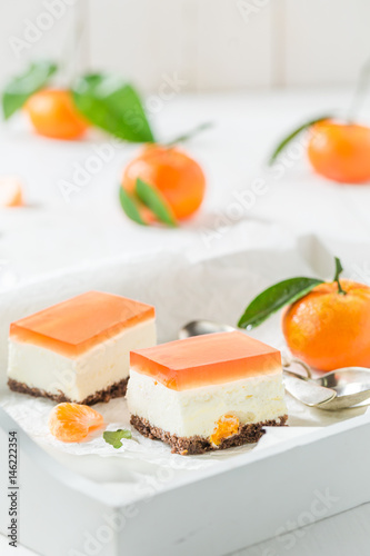 Tasty cheesecake with fresh mandarin and jelly