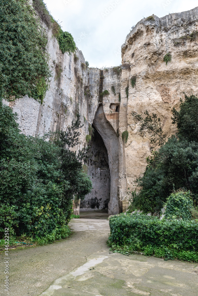 So called Ear of Dionysius cave in ancient quarry, Neapolis Archaeological Park in Syracuse, Sicily Island of Italy