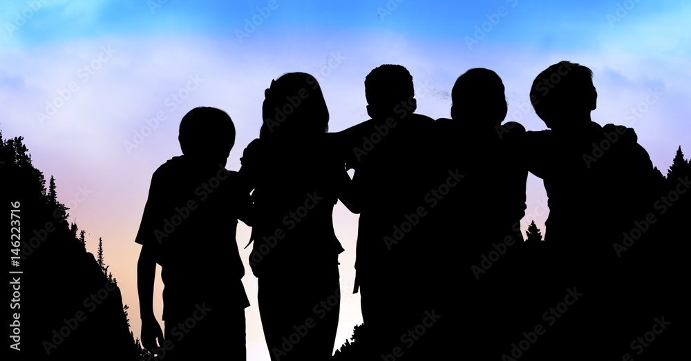 Silhouette children standing arms around