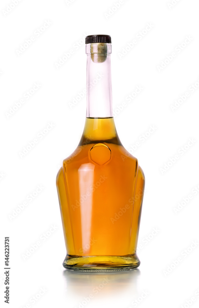 Closed bottle of cognac on white background Closed bottle of cognac on white background