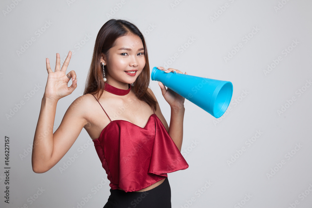 Beautiful young Asian woman show OK announce with megaphone. Beautiful young Asian woman show OK announce with megaphone.