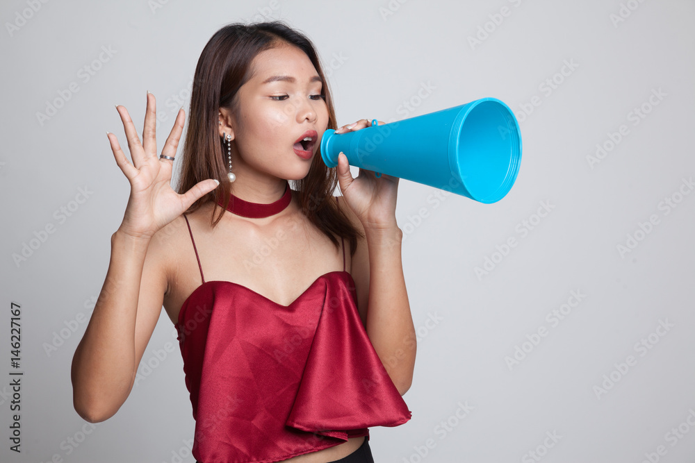 Beautiful young Asian woman announce with megaphone. Beautiful young Asian woman announce with megaphone.