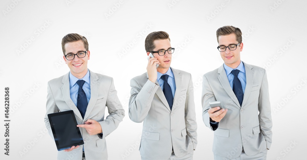 Multiple image of businessman with smart phone and tablet PC Multiple image of businessman with smart phone and tablet PC