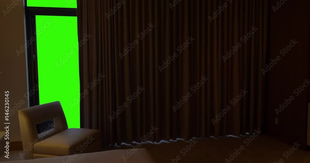 Curtains automatically open in a luxurious hotel bedroom to reveal a large green screen view.  	