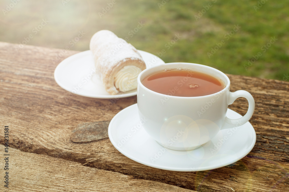 cup of tea with lemon on wooden background cup of tea with lemon on wooden background