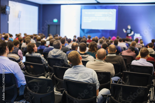 Abstract blurred photo of conference hall or seminar room with attendee background