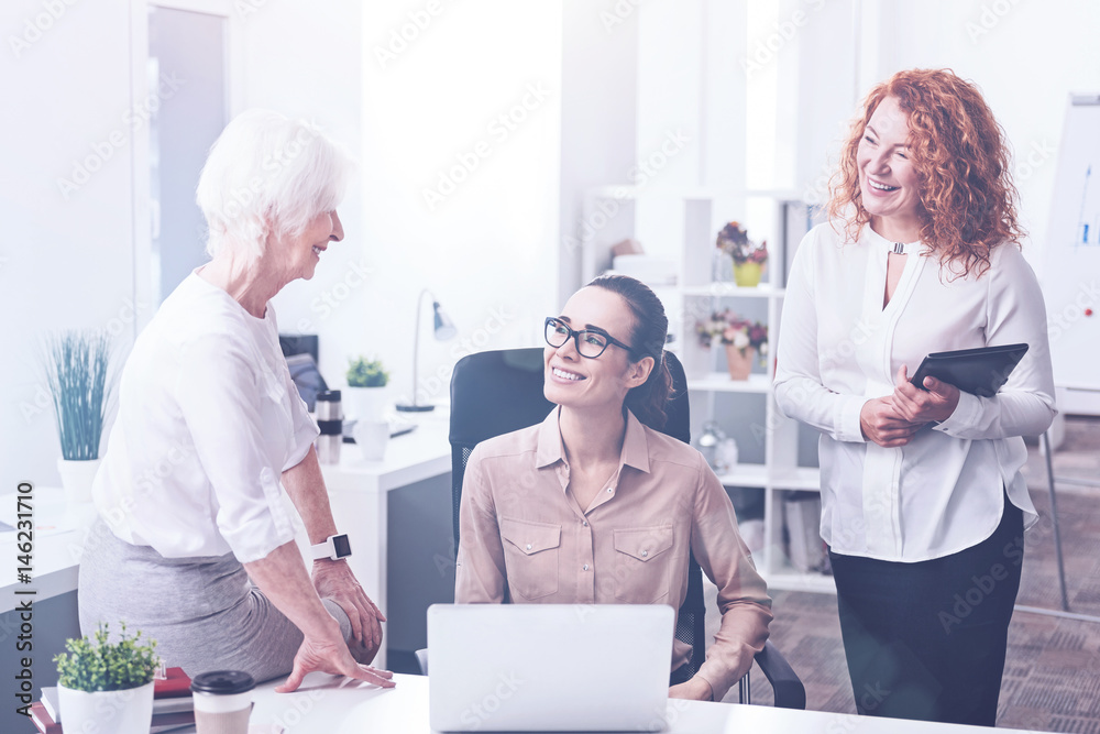 Three female workers being in the office Three female workers being in the office