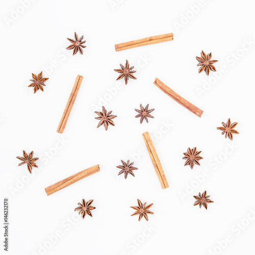 Natural pattern made of cinnamon and anise tree on white background. Spice. Flat lay. Top view.