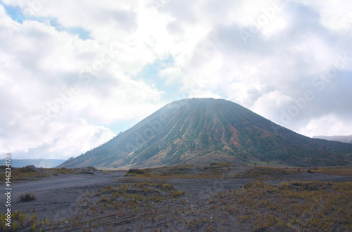 Mount Bromo, active volcano with cloudy sky at the Tengger Semeru National Park in East Java, Indonesia.