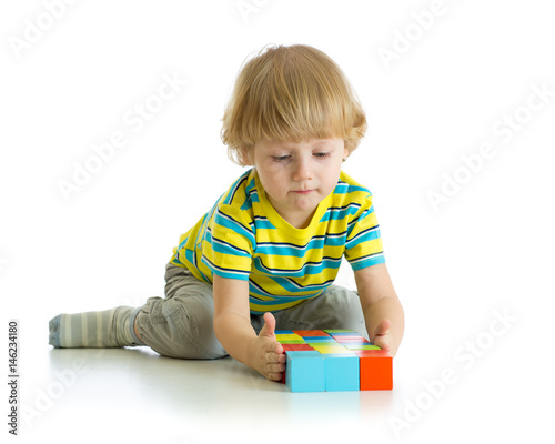 Little boy playing toy isol...
