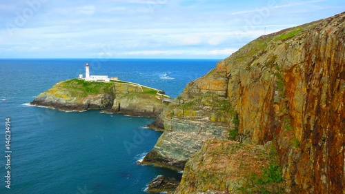 The South Stack Lighthouse - built on the summit of a small island off the north-west coast of Holy Island, Anglesey, Wales. Historically built in 1809 to warn ships of the dangerous rocks below.