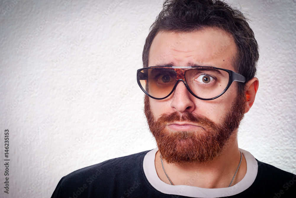 Caucasian man with fancy broken glasses