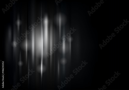 Horizontal dark background with luminous particles and vertical lines. Black background with colored strings and sparks