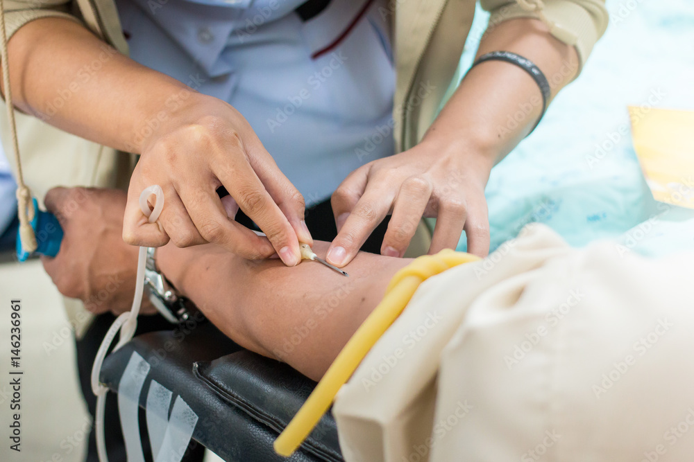 Fototapeta premium Young blood donor With pleasure