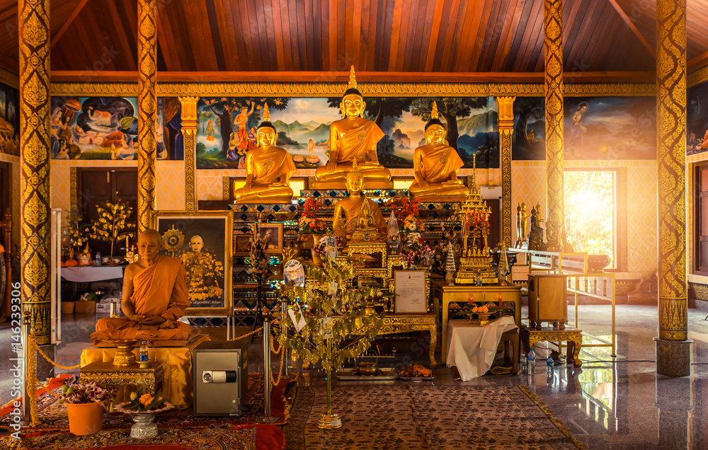 Thai temple interior with Buddha. Wat Patong Suwankeereewong Temple Phuket, Thailand. Thai temple interior with Buddha. Wat Patong Suwankeereewong Temple Phuket, Thailand.