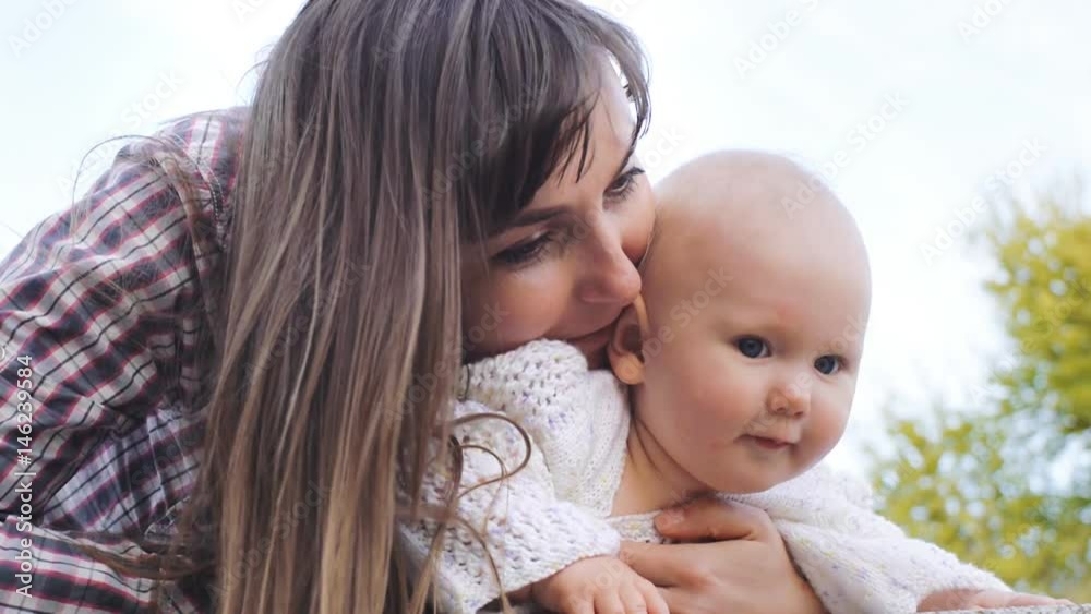 Happy mother and baby having fun and playing together Happy mother and baby having fun and playing together