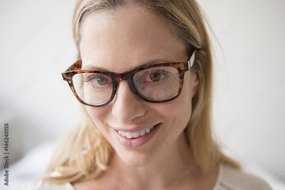 Portrait of smiling Caucasian woman wearing eyeglasses Portrait of smiling Caucasian woman wearing eyeglasses