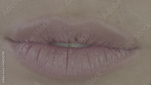 Lips closeup. Sexy sensual pink lip, mouth open, white teeth. Beautiful Woman portrait, close-up big lips, bright lipstick. Beautiful mouth with lush Lips. Girl's Face, close-up lips, mouth open photo