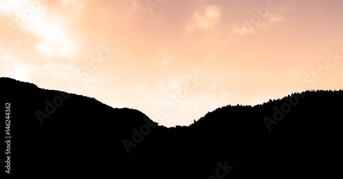 Silhouette mountain against sky during sunset © vectorfusionart