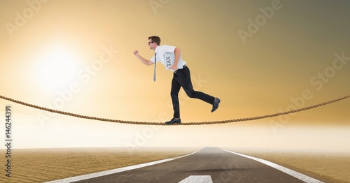 Businessman with tax newspaper walking on rope over highway