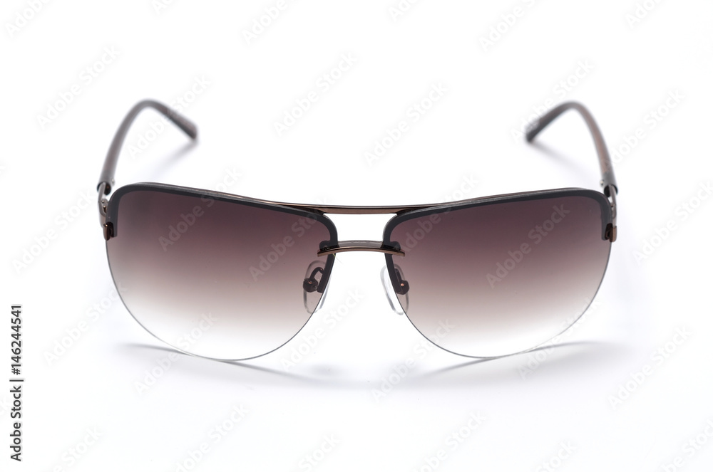 Sunglasses in an iron frame with brown glass isolated on white Sunglasses in an iron frame with brown glass isolated on white