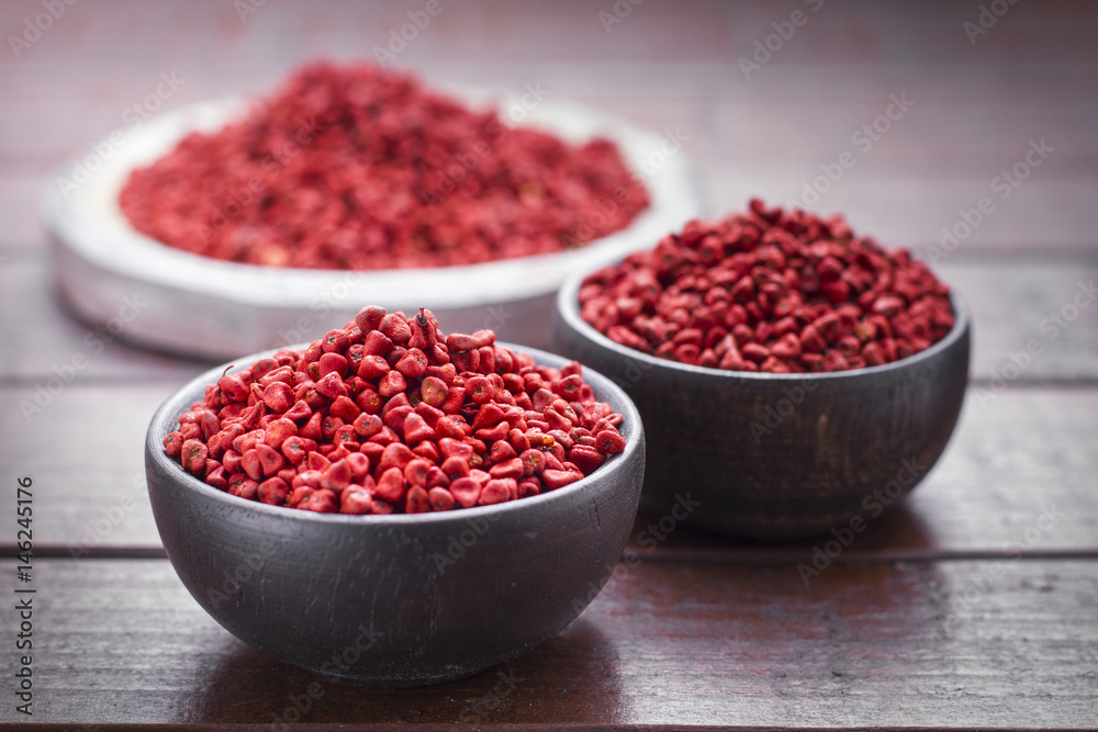 Seeds of achiote, originating from central america and parts of south america is used to season and color food