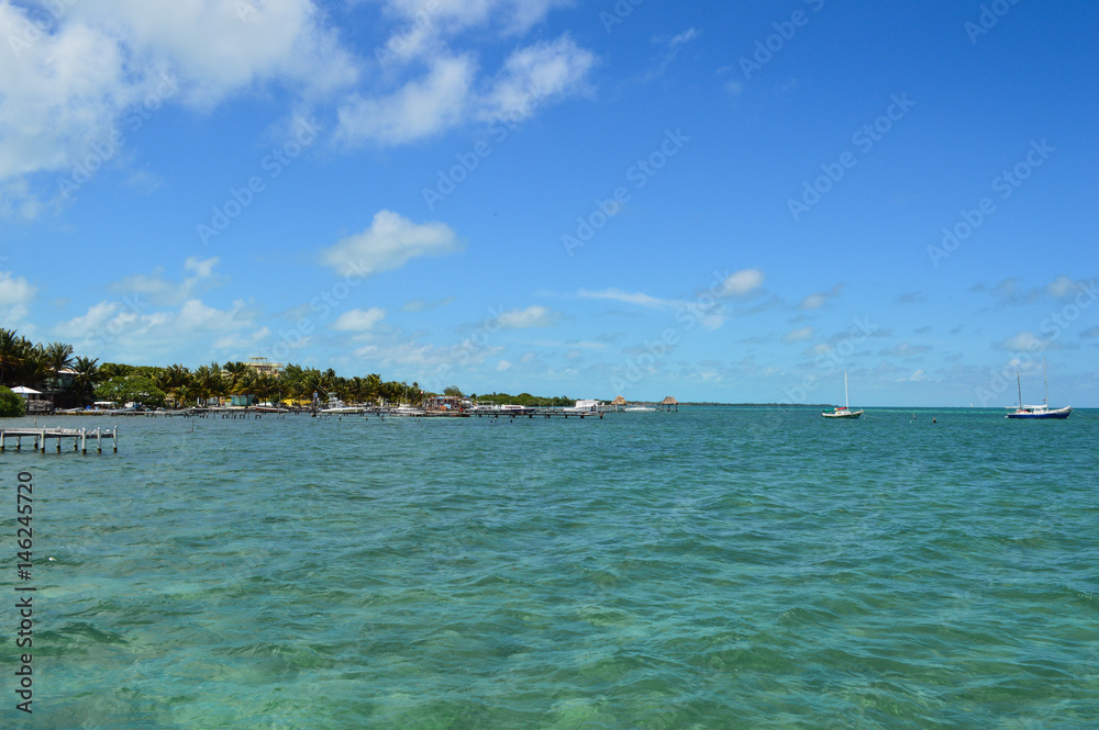 Pier with Crystal Clear Caribbean Waters, Caye Caulker, Belize Pier with Crystal Clear Caribbean Waters, Caye Caulker, Belize