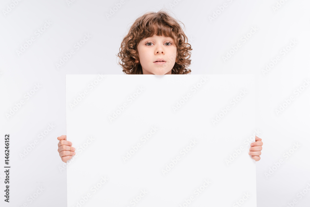 Boy holding white blank board Boy holding white blank board