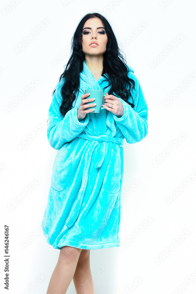 sexy girl posing in turquoise velour bathrobe with cup sexy girl posing in turquoise velour bathrobe with cup