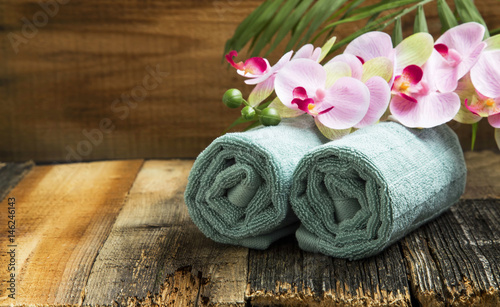 Spa still life with orchid flowers and soft towels