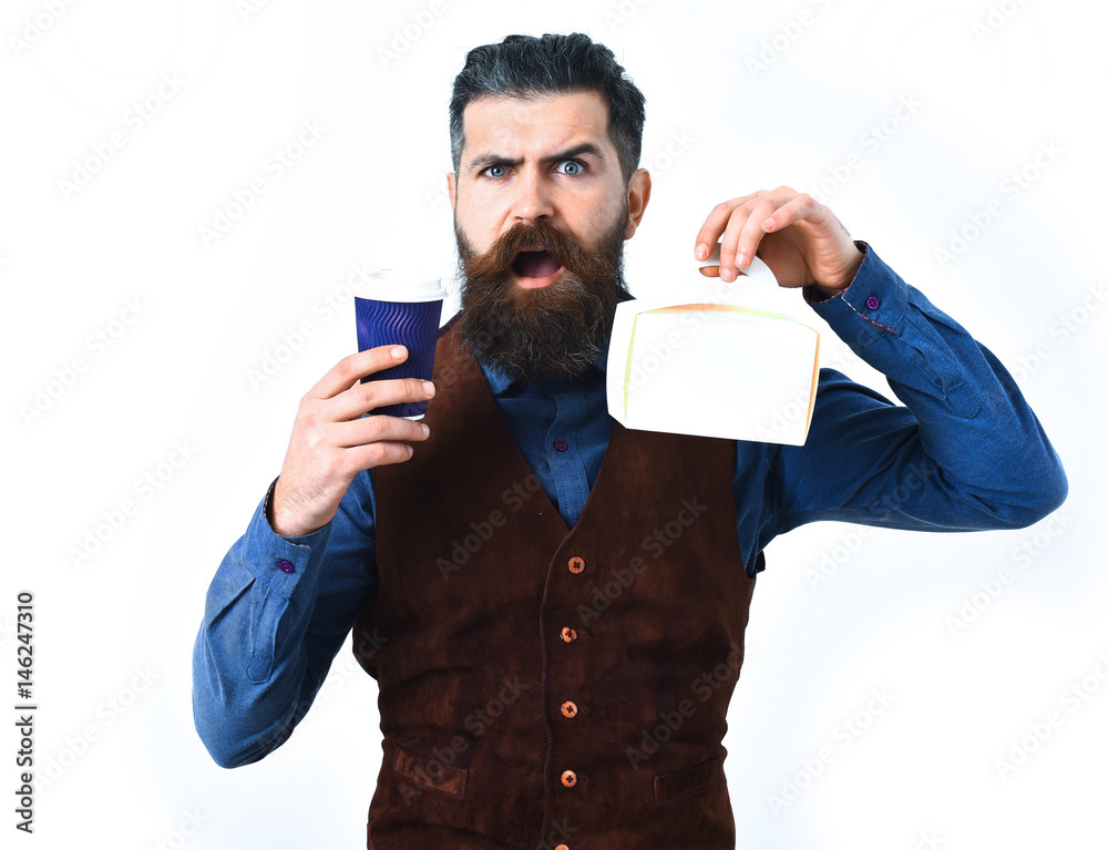 Bearded brutal caucasian hipster with coffee cup and meal box Bearded brutal caucasian hipster with coffee cup and meal box