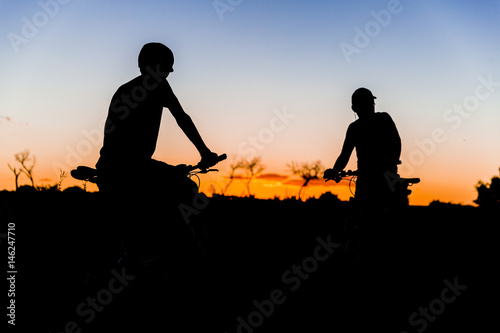 bikers taking a break for sunset  