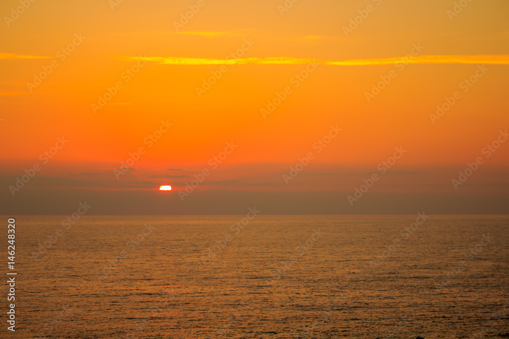 sea on sunset background.