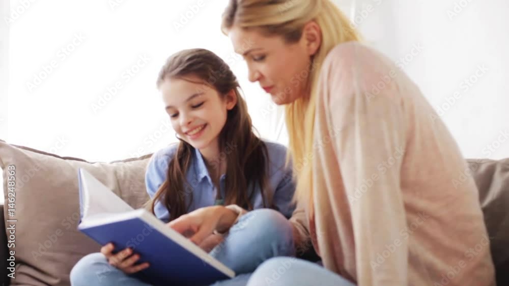 happy girl with mother reading book at home happy girl with mother reading book at home