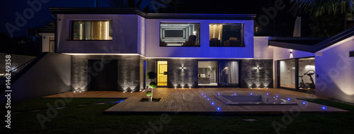 View of modern villa with pool in the night © alexandre zveiger