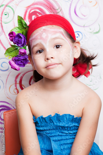 Child with flowers on her head 