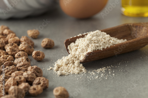 Wooden scoop with tigernut flour photo