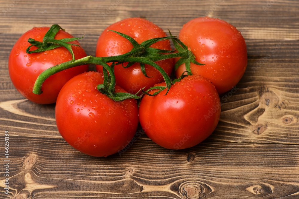 Ripe natural tomatoes on vine. Market fresh vegetable concept Ripe natural tomatoes on vine. Market fresh vegetable concept