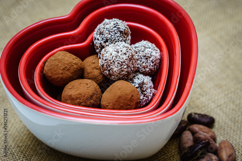 Vegan chocolate in heart shaped bowl