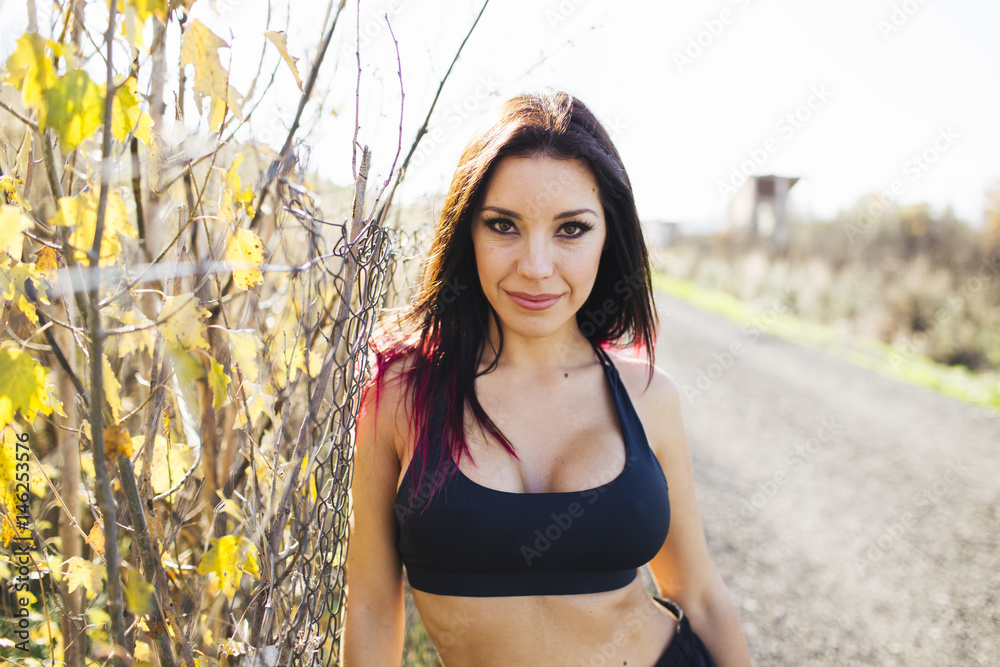 Young beautiful sportive woman training at park. Young beautiful sportive woman training at park.