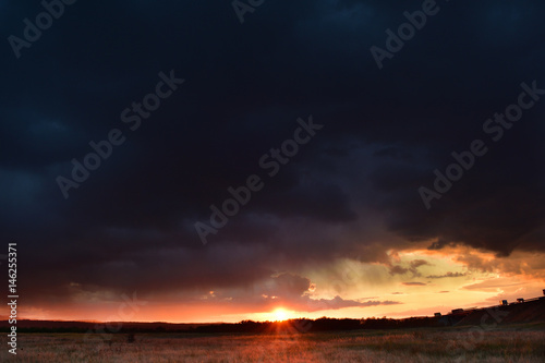 Dramatic sunset with colorful clouds in early Autumn