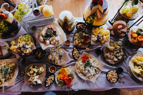 Look from above at table with cheese and other snacks