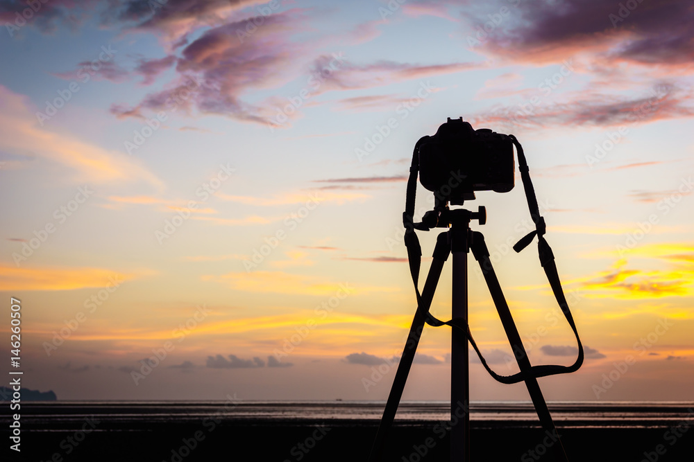 Camera and tripod on the sunset Camera and tripod on the sunset