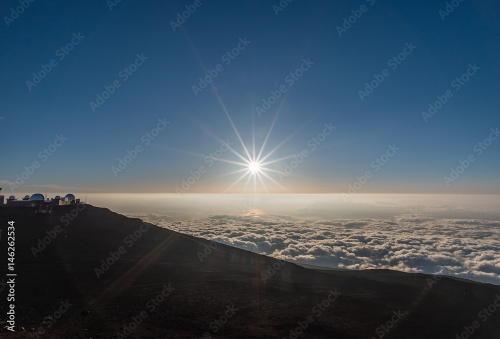 Setting sun viewed from the top of Haleakala crater on Maui, Hawaii