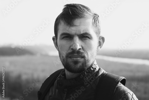 dramatic male portrait in a landscape,