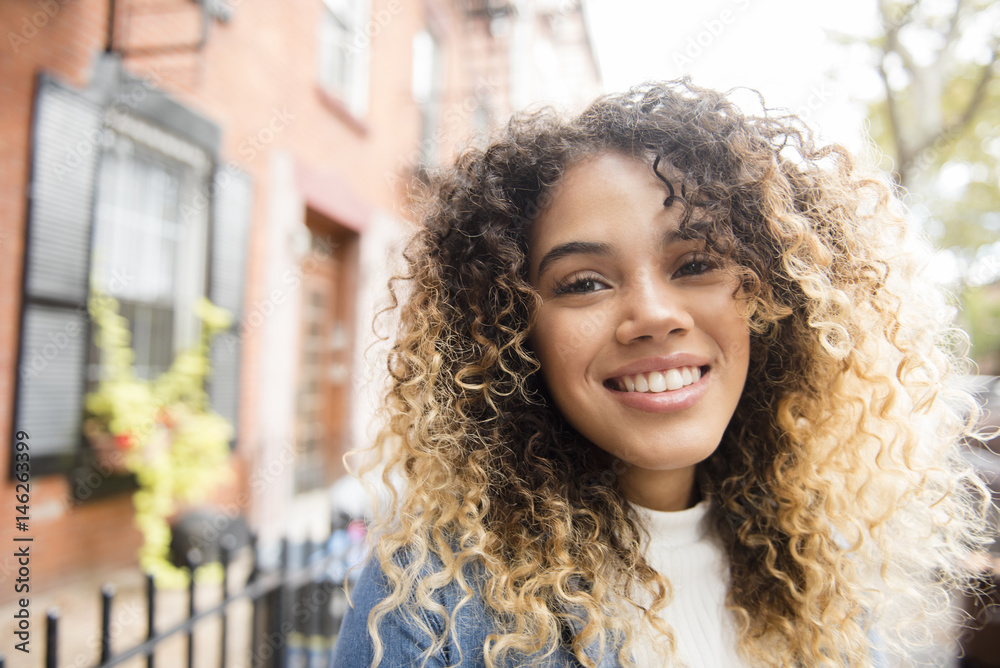Smiling Mixed Race woman in city Smiling Mixed Race woman in city