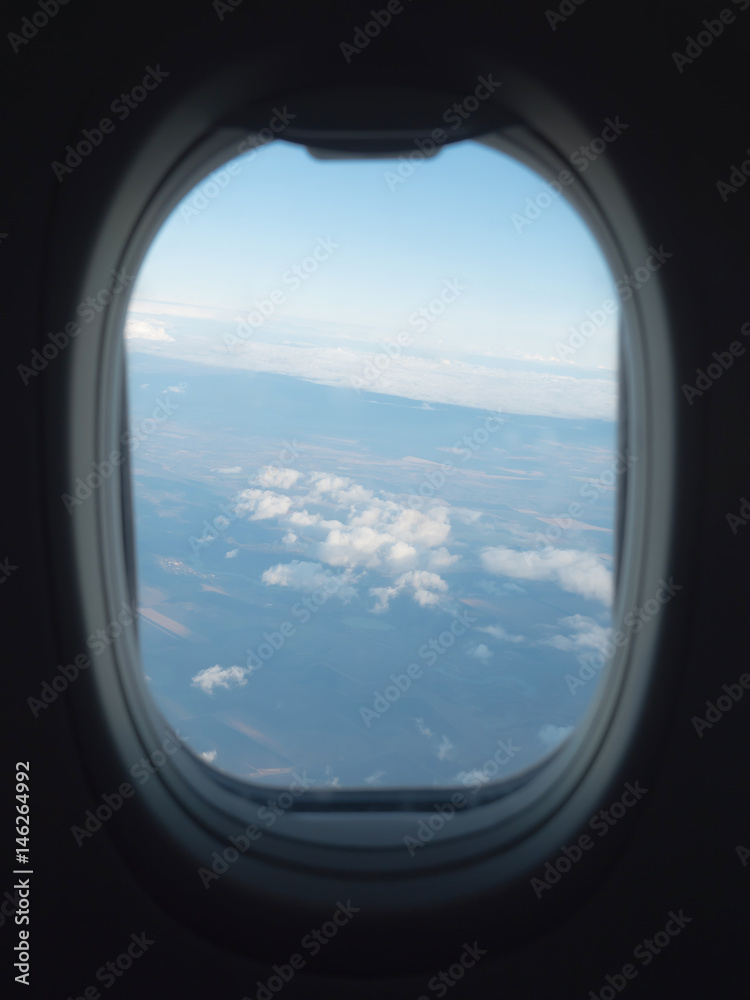 clouds in the aircraft's porthole